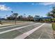 Shuffleboard courts ready for play, complete with shaded seating, near tennis courts at 27 Inlets Blvd # 27, Nokomis, FL 34275