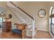 Beautiful staircase with hardwood floors and white railing, next to cushioned wood bench at 27 Inlets Blvd # 27, Nokomis, FL 34275