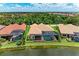 Aerial view of a home with a pool and screen enclosure backing onto a pond at 272 Maraviya Blvd, Nokomis, FL 34275