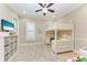 Bright bedroom featuring a loft bed with desk and soft, neutral carpet at 272 Maraviya Blvd, Nokomis, FL 34275