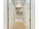 Hallway with a neutral color palette leads to other rooms in the house at 272 Maraviya Blvd, Nokomis, FL 34275