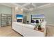 Elegant living room featuring a stone accent wall, fireplace, and views of the water at 272 Maraviya Blvd, Nokomis, FL 34275