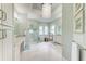 Bright bathroom features a large soaking tub, glass shower, and dual vanities at 272 Maraviya Blvd, Nokomis, FL 34275