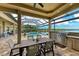 Outdoor dining space with stainless steel grill, and view of the lake at 272 Maraviya Blvd, Nokomis, FL 34275