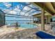 Inviting screened-in pool area with lake views, perfect for outdoor enjoyment at 272 Maraviya Blvd, Nokomis, FL 34275