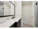 Modern bathroom featuring a sleek vanity with a dark faucet, a toilet, and a glass-enclosed shower at 2746 Tangelo Dr, Sarasota, FL 34239