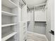 Organized walk-in closet with built-in shelving and drawers for optimal storage space at 2746 Tangelo Dr, Sarasota, FL 34239