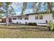 Charming home exterior featuring manicured landscaping and a convenient two-car garage at 2746 Tangelo Dr, Sarasota, FL 34239