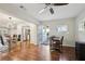 Open floor plan with hardwood floors connecting the dining area, kitchen and entryway at 2746 Tangelo Dr, Sarasota, FL 34239