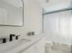 Bathroom featuring modern fixtures, vanity, and tiled shower at 2746 Tangelo Dr, Sarasota, FL 34239