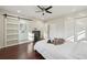 Bright main bedroom with a sliding barn door to the bathroom at 2746 Tangelo Dr, Sarasota, FL 34239