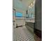 Bathroom showcasing tiled walls and floors, offering a clean and modern look at 2785 Sydelle St, Sarasota, FL 34237