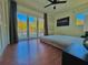 Bedroom with large windows overlooking the pool, features a sleek platform bed at 2785 Sydelle St, Sarasota, FL 34237