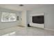 Bright living room with glossy marble floors, modern lighting, and an entertainment center at 2785 Sydelle St, Sarasota, FL 34237