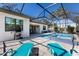 Backyard with sun loungers next to the pool and outdoor dining at 2823 Marshall Dr, Sarasota, FL 34239