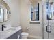 Stylish bathroom with a modern sink and vanity, with walk in shower at 2823 Marshall Dr, Sarasota, FL 34239