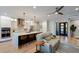 Open-concept living space, view of the kitchen island and front door with wood floors at 2823 Marshall Dr, Sarasota, FL 34239