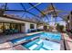 Screened-in pool with a tiled spa and lounge seating at 2823 Marshall Dr, Sarasota, FL 34239