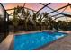 Private screened pool area with tropical landscaping at 2823 Marshall Dr, Sarasota, FL 34239