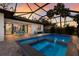 A private screened pool area offering tropical landscaping and outdoor seating at 2823 Marshall Dr, Sarasota, FL 34239