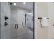 Modern walk-in shower featuring sleek fixtures, and a built-in seat at 2823 Marshall Dr, Sarasota, FL 34239