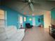 Bright living room with a white sofa, unique decor, and large windows, providing plenty of natural light at 3060 Arrowhead Rd, Venice, FL 34293