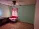 Comfortable bedroom with a desk, chair, and ceiling fan at 3252 Patton St, Sarasota, FL 34235