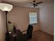 Bedroom featuring a modern desk, chair, and ample lighting at 3252 Patton St, Sarasota, FL 34235