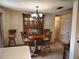 Cozy dining area featuring a wooden table set, china cabinet, and chandelier lighting at 3252 Patton St, Sarasota, FL 34235