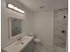 Clean and bright bathroom featuring tiled shower and modern vanity at 3325 Woodmont Dr, Sarasota, FL 34232