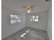 Bedroom featuring two windows, neutral walls and tiled floors at 3325 Woodmont Dr, Sarasota, FL 34232