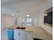 Bright kitchen featuring granite countertops, stainless appliances and view to living area at 3325 Woodmont Dr, Sarasota, FL 34232