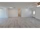 Open-concept living room featuring tiled flooring, natural light, and white walls at 3325 Woodmont Dr, Sarasota, FL 34232