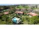 Aerial view of community pool and golf course, surrounded by lush landscaping and well-maintained grounds at 3500 El Conquistador Pkwy # 336, Bradenton, FL 34210