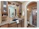 Beautiful bathroom with granite countertops, custom cabinets, and a walk-in shower at 3951 Palau Dr, Sarasota, FL 34241