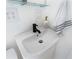 Small stylish bathroom sink with a black faucet at 3951 Palau Dr, Sarasota, FL 34241