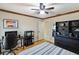 Inviting bedroom with a neutral color scheme, ceiling fan and built-in shelving at 3951 Palau Dr, Sarasota, FL 34241