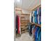 Spacious walk-in closet with custom shelving and ample storage for clothes and shoes at 3951 Palau Dr, Sarasota, FL 34241