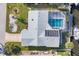 Aerial view showcasing the home, private pool, boat dock, and waterfront access at 5012 Bimini Dr, Bradenton, FL 34210