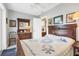 Bedroom showcasing a queen-sized bed with a decorative headboard and furnishings at 5012 Bimini Dr, Bradenton, FL 34210