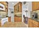 Well-lit kitchen featuring wooden cabinetry, a white oven range, and granite countertops at 5012 Bimini Dr, Bradenton, FL 34210