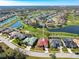 Overhead view of a home near a golf course and lake, showcasing the community's serene setting at 5080 Kilty E Ct, Bradenton, FL 34203