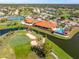 Overhead view of the golf course and clubhouse and pool offering a scenic and active lifestyle within the community at 5080 Kilty E Ct, Bradenton, FL 34203