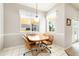 Bright breakfast nook with a table, chairs, and natural light from windows at 5080 Kilty E Ct, Bradenton, FL 34203