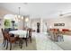 Open dining and living areas feature tile flooring, natural light, and neutral tones at 5080 Kilty E Ct, Bradenton, FL 34203