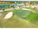 Scenic golf course aerial showcases the lush green with players enjoying a sunny day on the green at 5080 Kilty E Ct, Bradenton, FL 34203