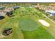 Beautiful aerial view of a meticulously maintained golf course with lush green fairways and manicured greens at 5080 Kilty E Ct, Bradenton, FL 34203