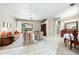 Spacious living room with neutral tones, ceiling fan, sliding glass doors and access to the pool area at 5080 Kilty E Ct, Bradenton, FL 34203