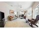 Spacious living room leading to the kitchen, with comfortable seating and ample natural light at 5080 Kilty E Ct, Bradenton, FL 34203