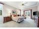 Serene main bedroom with double doors leading to the outside, complemented by stylish furniture at 5080 Kilty E Ct, Bradenton, FL 34203